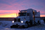 Truck parked on a snow covered area - Slickline Services Red Deer AB by Quick Silver