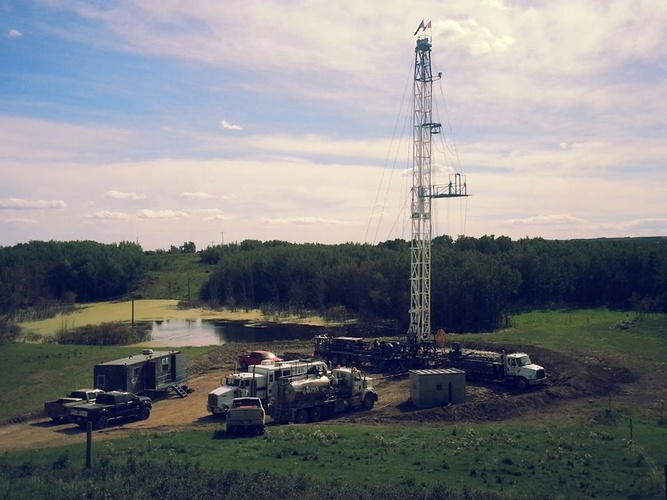 Vehicles at Site - Offset Well Monitoring Services Red Deer Alberta by Quick Silver Wireline