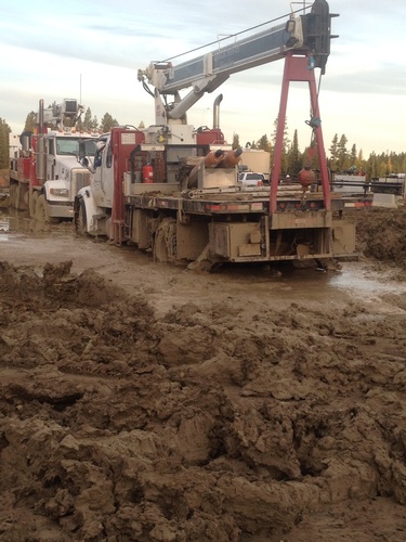 Truck near a Muddy Area - Wireline Services in Red Deer by Quick Silver Wireline