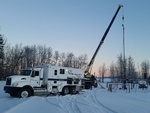 Quick Silver Wireline Truck on a Snow Covered area - Offset Well Monitoring Services Red Deer