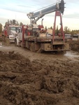 Truck near a Muddy Area - Wireline Services in Red Deer by Quick Silver Wireline